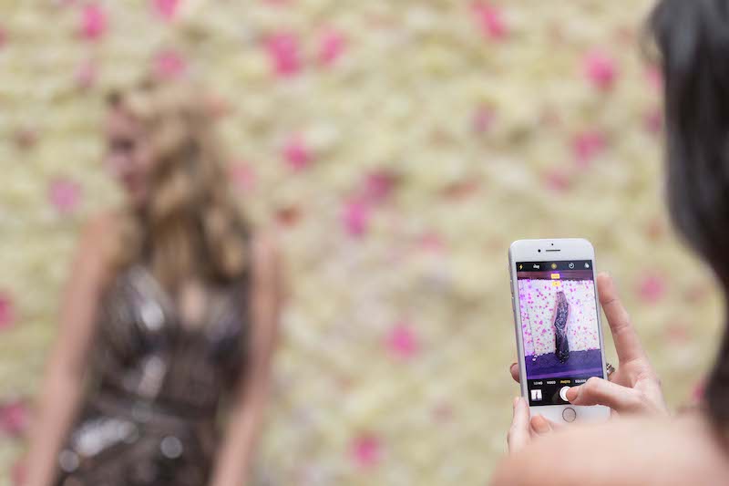 A floral backdrop can help make an event Instagrammable and encourage social sharing on Instagram, Twitter and Facebook